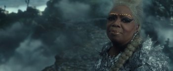 Movie still from “A Wrinkle in Time” (2018), directed by Ava DuVernay – A person wearing a costume; Close Up shot, Over the shoulder angle