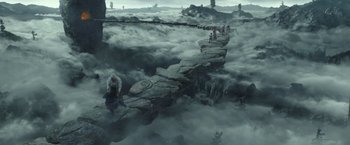 Movie still from “A Wrinkle in Time” (2018), directed by Ava DuVernay – A group of people standing on top of a rock formation; Extreme Wide shot, High angle