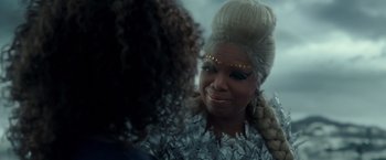 Movie still from “A Wrinkle in Time” (2018), directed by Ava DuVernay – A woman in a white wig is talking to another woman; Close Up shot, Over the shoulder angle