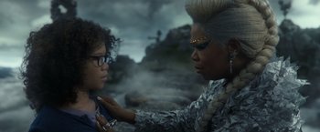 Movie still from “A Wrinkle in Time” (2018), directed by Ava DuVernay – A woman touching a child's face in a scene from the movie a wrinkle in time; Close Up shot, Over the shoulder angle