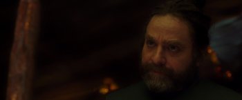 Movie still from “A Wrinkle in Time” (2018), directed by Ava DuVernay – A person with a beard looking at the camera; Close Up shot, Low angle