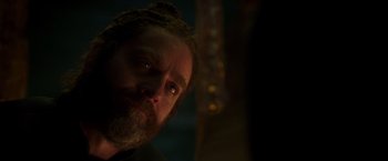 Movie still from “A Wrinkle in Time” (2018), directed by Ava DuVernay – A person with a beard looking at the camera; Close Up shot, Over the shoulder angle