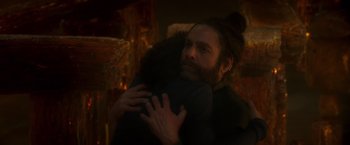 Movie still from “A Wrinkle in Time” (2018), directed by Ava DuVernay – A man with a beard is hugging another man; Close Up shot, Over the shoulder angle