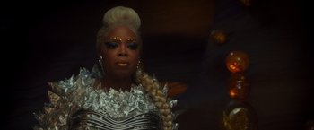 Movie still from “A Wrinkle in Time” (2018), directed by Ava DuVernay – A woman in a silver dress with long blonde hair; Close Up shot, Over the shoulder angle