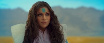 Movie still from “A Wrinkle in Time” (2018), directed by Ava DuVernay – A woman with long black hair and a blue forehead band; Close Up shot, Over the shoulder angle