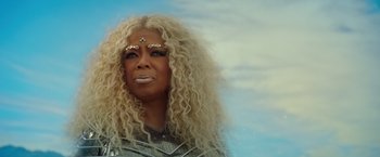 Movie still from “A Wrinkle in Time” (2018), directed by Ava DuVernay – A woman that is wearing a blonde wig; Close Up shot, Low angle