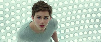 Movie still from “A Wrinkle in Time” (2018), directed by Ava DuVernay – A young man is posing for a picture; Close Up shot, Overhead angle