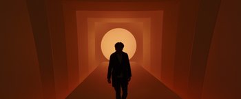 Movie still from “A Wrinkle in Time” (2018), directed by Ava DuVernay – A person is walking in a tunnel with a bright orange light; Wide shot, Low angle
