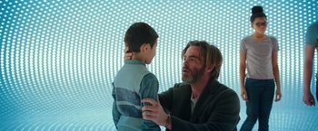 Movie still from “A Wrinkle in Time” (2018), directed by Ava DuVernay – A man and a boy are looking at each other; Medium shot, Low angle