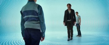 Movie still from “A Wrinkle in Time” (2018), directed by Ava DuVernay – A group of people standing around in a room; Wide shot, Low angle