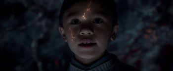 Movie still from “A Wrinkle in Time” (2018), directed by Ava DuVernay – A little boy that is looking at the camera; Close Up shot, Overhead angle