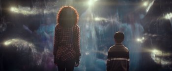 Movie still from “A Wrinkle in Time” (2018), directed by Ava DuVernay – A woman and a boy standing in front of an aquarium; Medium shot, Low angle