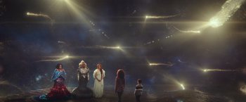 Movie still from “A Wrinkle in Time” (2018), directed by Ava DuVernay – A group of people standing in front of a sky filled with stars; Extreme Wide shot, Overhead angle