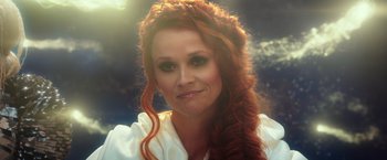 Movie still from “A Wrinkle in Time” (2018), directed by Ava DuVernay – A person with long red hair; Close Up shot, Over the shoulder angle