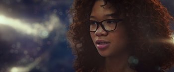 Movie still from “A Wrinkle in Time” (2018), directed by Ava DuVernay – A person wearing glasses with curly hair; Close Up shot, Over the shoulder angle