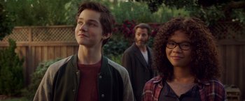 Movie still from “A Wrinkle in Time” (2018), directed by Ava DuVernay – A group of people standing next to each other in a yard; Close Up shot, Over the shoulder angle