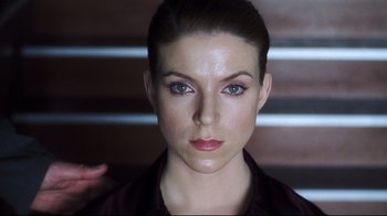 Movie still from “A.I. Artificial Intelligence” (2001), directed by Steven Spielberg – A woman's face in a purple shirt; Close Up shot, Low angle