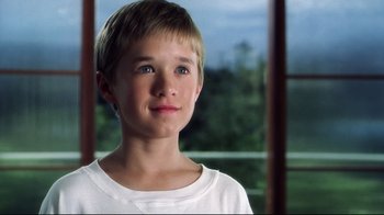 Movie still from “A.I. Artificial Intelligence” (2001), directed by Steven Spielberg – A young boy is looking into the distance; Close Up shot, Low angle