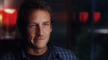 Movie still from “A.I. Artificial Intelligence” (2001), directed by Steven Spielberg – A person wearing a blue shirt; Close Up shot, Over the shoulder angle