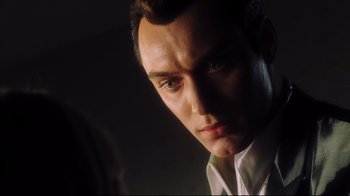 Movie still from “A.I. Artificial Intelligence” (2001), directed by Steven Spielberg – A person wearing a white shirt; Close Up shot, Low angle