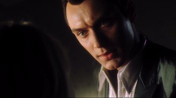 Movie still from “A.I. Artificial Intelligence” (2001), directed by Steven Spielberg – A man's face in the dark; Close Up shot, Low angle