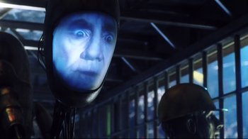 Movie still from “A.I. Artificial Intelligence” (2001), directed by Steven Spielberg – A man with a helmet on is looking into the camera; Close Up shot, Over the shoulder angle