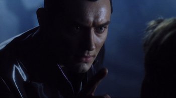 Movie still from “A.I. Artificial Intelligence” (2001), directed by Steven Spielberg – A man's face in the dark; Close Up shot, Over the shoulder angle