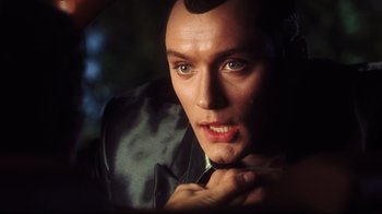 Movie still from “A.I. Artificial Intelligence” (2001), directed by Steven Spielberg – A man with a shaved head; Close Up shot, Over the shoulder angle