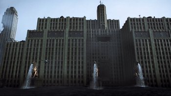 Movie still from “A.I. Artificial Intelligence” (2001), directed by Steven Spielberg – A woman standing in front of a large building; Extreme Wide shot, Low angle