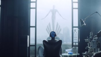 Movie still from “A.I. Artificial Intelligence” (2001), directed by Steven Spielberg – A man sitting in front of a window with a face on it; Wide shot, Low angle