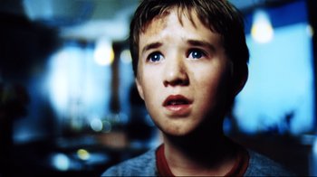 Movie still from “A.I. Artificial Intelligence” (2001), directed by Steven Spielberg – A young boy looking up into the air; Close Up shot, Low angle
