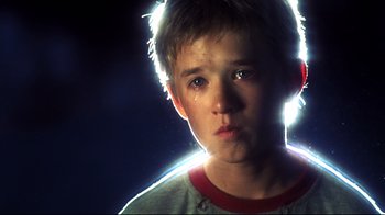 Movie still from “A.I. Artificial Intelligence” (2001), directed by Steven Spielberg – A young boy is crying in the dark; Close Up shot, Low angle