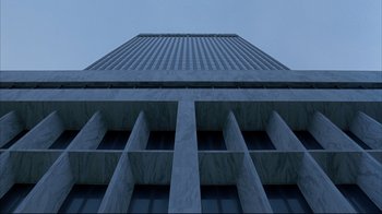 Movie still from “About Schmidt” (2002), directed by Alexander Payne – Looking up at a tall building from the ground up; Extreme Wide shot, Low angle