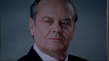 Movie still from “About Schmidt” (2002), directed by Alexander Payne – An older man wearing a suit and tie; Close Up shot, Low angle