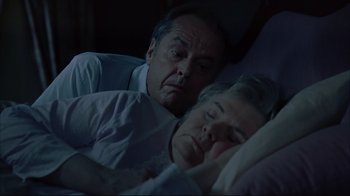 Movie still from “About Schmidt” (2002), directed by Alexander Payne – An older man and a younger woman sleeping in a bed; Close Up shot, High angle