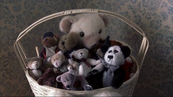Movie still from “About Schmidt” (2002), directed by Alexander Payne – Many stuffed animals in this basket; Extreme Close Up shot, Overhead angle