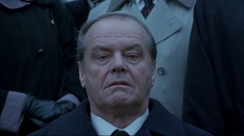 Movie still from “About Schmidt” (2002), directed by Alexander Payne – An older man wearing a suit and a tie; Close Up shot, Low angle