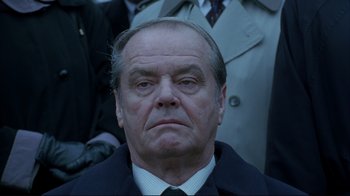 Movie still from “About Schmidt” (2002), directed by Alexander Payne – An older man in a suit and tie looking directly at the camera; Close Up shot, Low angle