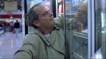 Movie still from “About Schmidt” (2002), directed by Alexander Payne – A man leaning against a refrigerator looking out of the freezer; Medium shot, Low angle