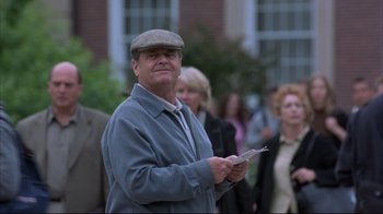 Movie still from “About Schmidt” (2002), directed by Alexander Payne – A man holding a piece of paper while standing in front of a group of people; Medium shot, Low angle