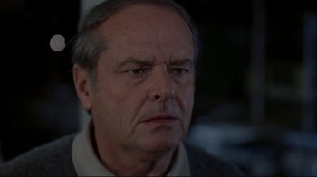 Movie still from “About Schmidt” (2002), directed by Alexander Payne – An older man with grey hair looking at the camera; Close Up shot, Over the shoulder angle
