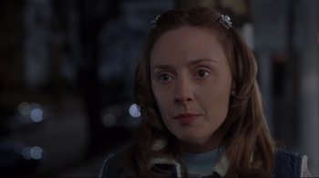 Movie still from “About Schmidt” (2002), directed by Alexander Payne – A person with long brown hair; Close Up shot, Over the shoulder angle