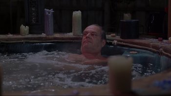 Movie still from “About Schmidt” (2002), directed by Alexander Payne – A man in a hot tub with candles around him; Medium shot, High angle