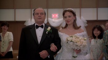 Movie still from “About Schmidt” (2002), directed by Alexander Payne – A man and a woman in a wedding dress; Medium shot, Low angle