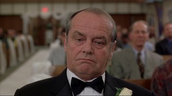 Movie still from “About Schmidt” (2002), directed by Alexander Payne – An older man wearing a tuxedo and a bow tie; Close Up shot, Low angle