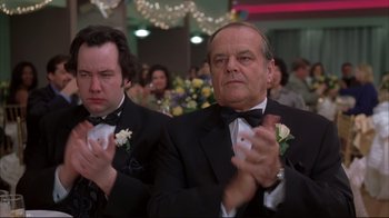 Movie still from “About Schmidt” (2002), directed by Alexander Payne – Two men in tuxedos clapping at a formal event; Close Up shot, Low angle