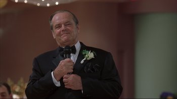 Movie still from “About Schmidt” (2002), directed by Alexander Payne – A man in a tuxedo is holding a microphone; Close Up shot, Low angle