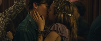 Movie still from “About Time” (2013), directed by Richard Curtis – A man and a woman kissing each other in front of a wall; Close Up shot, Overhead angle