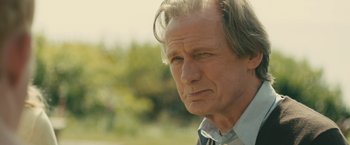 Movie still from “About Time” (2013), directed by Richard Curtis – An older man is looking into the distance; Close Up shot, Over the shoulder angle