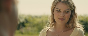 Movie still from “About Time” (2013), directed by Richard Curtis – A person wearing a necklace; Close Up shot, Over the shoulder angle